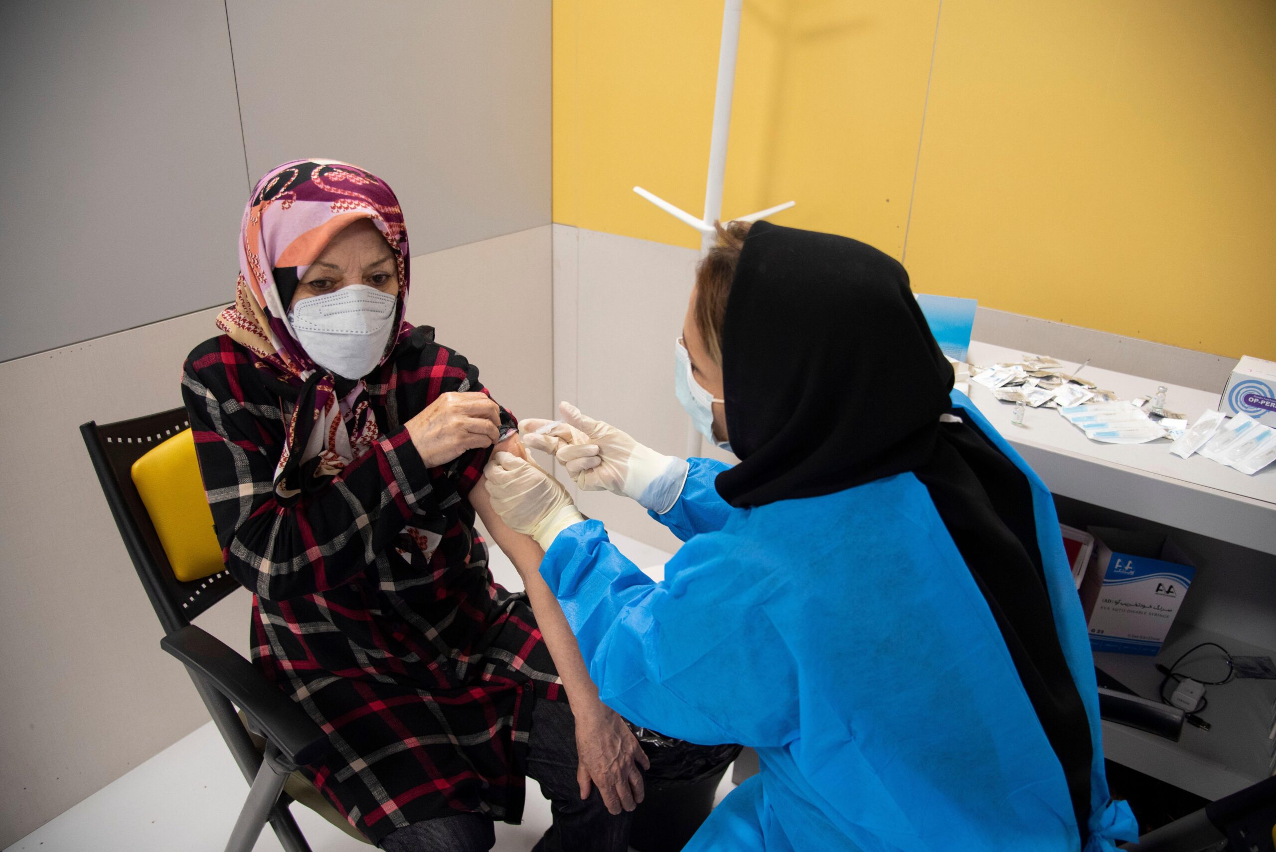 An Iranian Woman receives a dose of the China's Sinopharm new coronavirus disease (COVID-19) vaccine in the Iranmall shopping complex in northwest of Tehran, Iran on May 17, 2021. (Photo by Sobhan Farajvan/Pacific Press/Sipa USA) Credit: Sipa USA/Alamy Live News