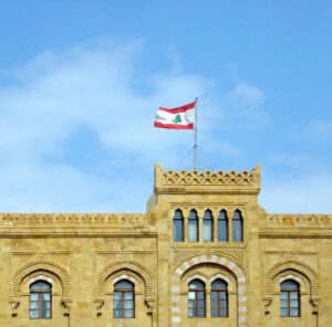 Historic building in Lebanon flying the Lebanese flag