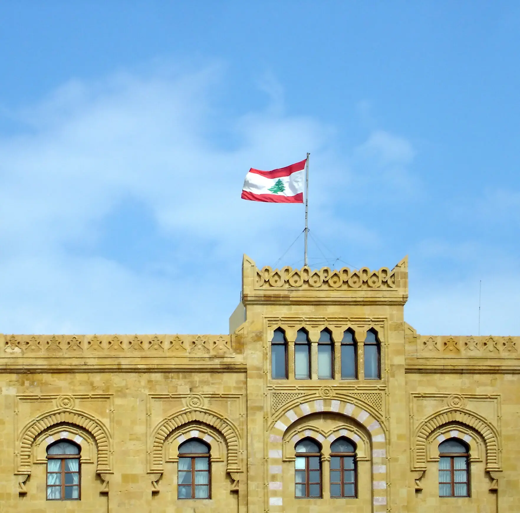 Historic building in Lebanon flying the Lebanese flag